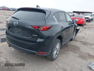 2020 Mazda CX-5 Grand Touring with VIN JM3KFADM8L0811910, listed as a IAAI auction lot 41446214 with 57,849 mi miles. Bid and sale history available at carsss.com. Image 4.