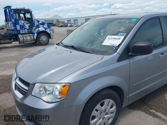 2015 Dodge Grand Caravan American Value with VIN 2C4RDGBGXFR542672, listed as a IAAI auction lot 42230608 with 102,753 mi miles and . Bid and sale history available at DreamBid. Image 6.
