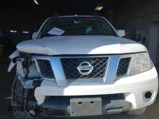 2014 Nissan Frontier SV with VIN 1N6AD0EV4EN736220, listed as a IAAI auction lot 41241823 with 91,789 mi miles and . Bid and sale history available at DreamBid. Image 12.
