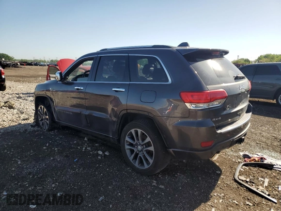 2017 Jeep Grand Cherokee Overland with VIN 1C4RJFCG0HC762612, listed as a Copart auction lot 57400095 with 122,702 mi miles and Salvage title. Bid and sale history available at DreamBid. Image 2.