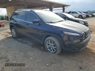 2015 Jeep Cherokee Latitude with VIN 1C4PJLCBXFW700186, listed as a Copart auction lot 49210955 with 160,087 mi miles and Salvage Title. Bid and sale history available at DreamBid. Image 4.