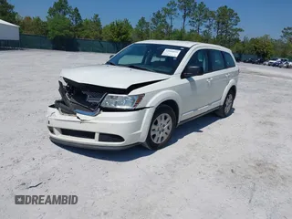 2015 Dodge Journey SE z VIN 3C4PDCAB7FT572716, wystawiony jako IAAI lot #42010091 z przebiegiem 186 489 mil mil oraz . Historia ofert i sprzedaży dostępna na DreamBid. Obrazek 16.