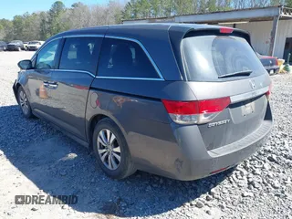 2014 Honda Odyssey EX-L with VIN 5FNRL5H61EB014695, listed as a IAAI auction lot 41694860 with 261,265 mi miles and . Bid and sale history available at DreamBid. Image 3.