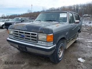1987 Ford Bronco XL with VIN 1FMEU15N4HLA38776, listed as a IAAI auction lot 41767617 with 52,914 mi miles. Bid and sale history available at carsss.com. Image 2.