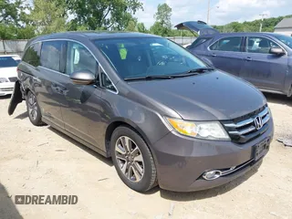 2014 Honda Odyssey Touring with VIN 5FNRL5H99EB138952, listed as a IAAI auction lot 42538833 with 146,959 mi miles and . Bid and sale history available at DreamBid. Image 1.