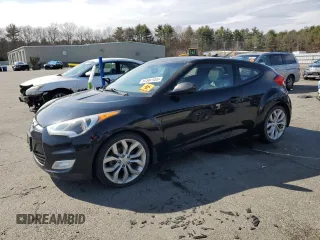 2013 Hyundai Veloster w/Black Int z VIN KMHTC6AD5DU173029, wystawiony jako Copart lot #52587455 z przebiegiem 161 716 mil mil oraz Czysty tytuł • Clean title. Historia ofert i sprzedaży dostępna na DreamBid. Obrazek 1.