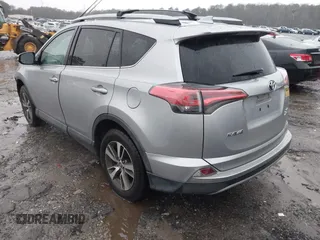 2018 Toyota RAV4 XLE with VIN 2T3RFREV2JW717351, listed as a IAAI auction lot 41576522 with 147,116 mi miles. Bid and sale history available at carsss.com. Image 3.