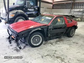1986 Pontiac Fiero z VIN 1G2PG9796GP252814, wystawiony jako Copart lot #46706275 z przebiegiem 158 701 mil mil oraz Tytuł czysty. Historia ofert i sprzedaży dostępna na DreamBid. Obrazek 1.