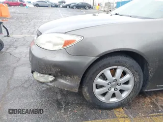 2004 Toyota Camry LE with VIN JTDBF32K740152841, listed as a IAAI auction lot 41808909 with 142,611 mi miles. Bid and sale history available at carsss.com. Image 6.