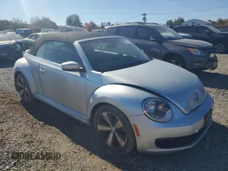 2013 Volkswagen Beetle 2.5L with VIN 3VW5P7ATXDM803952, listed as a Copart auction lot 76971934 with 211,449 mi miles and Salvage Title. Bid and sale history available at DreamBid. Image 4.