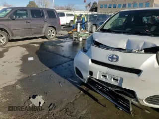 2014 Scion iQ with VIN JTNJJXB01EJ026837, listed as a Copart auction lot 43596385 with 52,826 mi miles and Salvage title. Bid and sale history available at DreamBid. Image 12.