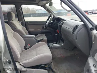 2001 Toyota 4Runner SR5 with VIN JT3GN86R210191592, listed as a IAAI auction lot 41574192 with 217,702 mi miles. Bid and sale history available at carsss.com. Image 5.