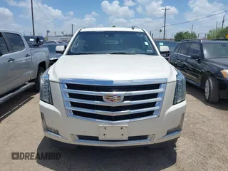 2015 Cadillac Escalade Luxury z VIN 1GYS4BKJ1FR215223, wystawiony jako IAAI lot #42548931 z przebiegiem 145 947 mil mil oraz . Historia ofert i sprzedaży dostępna na DreamBid. Obrazek 12.