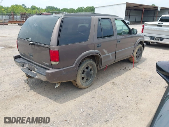 1999 Oldsmobile Bravada z VIN 1GHDT13W3X2710047, wystawiony jako IAAI lot #42481978 z przebiegiem Nie podano mil oraz . Historia ofert i sprzedaży dostępna na DreamBid. Obrazek 4.