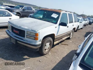 1996 GMC Yukon with VIN 1GKEK13R2TJ746811, listed as a IAAI auction lot 41955840 with 2,242,108 mi miles. Bid and sale history available at carsss.com. Image 2.