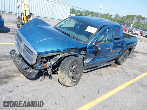 2005 Dodge Dakota SLT with VIN 1D7HW48N05S319621, listed as a IAAI auction lot 42037140 with 251,595 mi miles and . Bid and sale history available at DreamBid. Image 2.