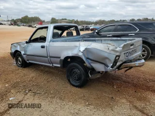 1990 Toyota Pickup DX с VIN JT4RN81P1L5069533, выставлен на аукционе Copart как лот 78433024 с пробегом 277 999 миль миль и Списание • Salvage title. История ставок и продаж доступна на DreamBid. Изображение 2.