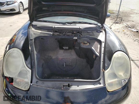 2000 Porsche Boxster z VIN WP0CA2988YU627807, wystawiony jako Copart lot #45522955 z przebiegiem 120 384 mil mil oraz Szkody całkowita. Historia ofert i sprzedaży dostępna na DreamBid. Obrazek 11.