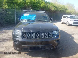 2018 Jeep Grand Cherokee Laredo E with VIN 1C4RJFAG2JC320441, listed as a IAAI auction lot 42095419 with 136,962 mi miles. Bid and sale history available at carsss.com. Image 12.