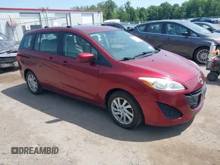 2012 Mazda 5 Sport with VIN JM1CW2BLXC0103509, listed as a IAAI auction lot 42534899 with 172,698 mi miles and . Bid and sale history available at DreamBid. Image 1.