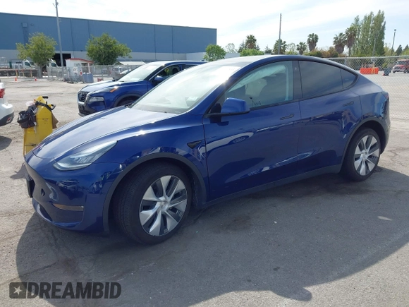 2020 Tesla Model Y Long Range with VIN 5YJYGDEE1LF006227, listed as a IAAI auction lot 42100833 with 49,761 mi miles and . Bid and sale history available at DreamBid. Image 2.