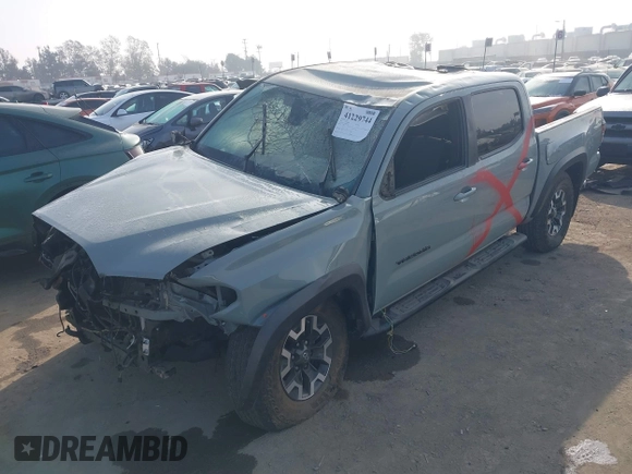 2022 Toyota Tacoma SR with VIN 3TYCZ5AN2NT096491, listed as a IAAI auction lot 42093897 with 47,041 mi miles and . Bid and sale history available at DreamBid. Image 2.