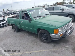 1988 Toyota Pickup z VIN JT4RN50R6J5112875, wystawiony jako IAAI lot #42061390 z przebiegiem 171 109 mil mil oraz . Historia ofert i sprzedaży dostępna na DreamBid. Obrazek 1.