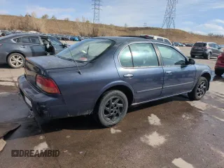 1997 Nissan Maxima GXE with VIN JN1CA21D0VT201140, listed as a Copart auction lot 52230495 with 286,440 mi miles and Clean title. Bid and sale history available at DreamBid. Image 3.
