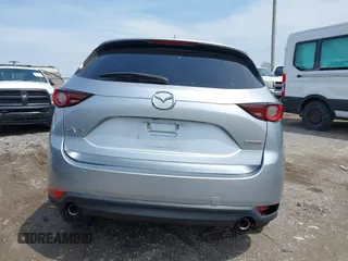 2020 Mazda CX-5 Touring with VIN JM3KFACM9L0785464, listed as a IAAI auction lot 42023311 with 90,062 mi miles and . Bid and sale history available at DreamBid. Image 16.