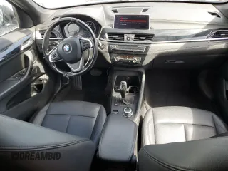 2020 BMW X1 xDrive28i with VIN WBXJG9C0XL5R33141, listed as a Copart auction lot 63040155 with 165,172 mi miles and Clean title. Bid and sale history available at DreamBid. Image 8.