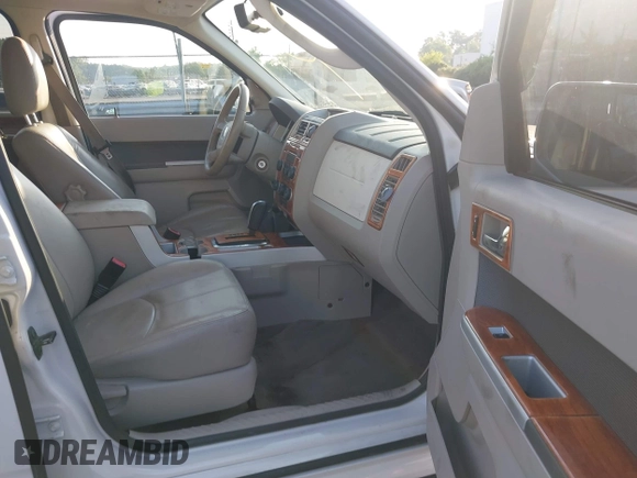 2011 Mercury Mariner Premier with VIN 4M2CN8HG0BKJ02401, listed as a IAAI auction lot 42579483 with 126,276 mi miles and . Bid and sale history available at DreamBid. Image 5.