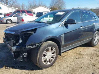2015 Cadillac SRX with VIN 3GYFNAE35FS608595, listed as a IAAI auction lot 41282751 with 127,055 mi miles and . Bid and sale history available at DreamBid. Image 2.