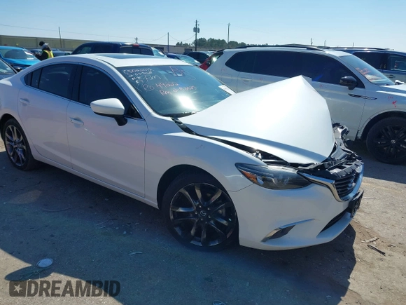 2016 Mazda 6 i Grand Touring with VIN JM1GJ1W57G1403028, listed as a IAAI auction lot 41591235 with 110,079 mi miles and . Bid and sale history available at carsss.com. Image 1.