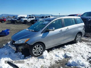 2014 Mazda 5 Sport with VIN JM1CW2BLXE0168119, listed as a IAAI auction lot 41527688 with 142,357 mi miles and . Bid and sale history available at DreamBid. Image 2.