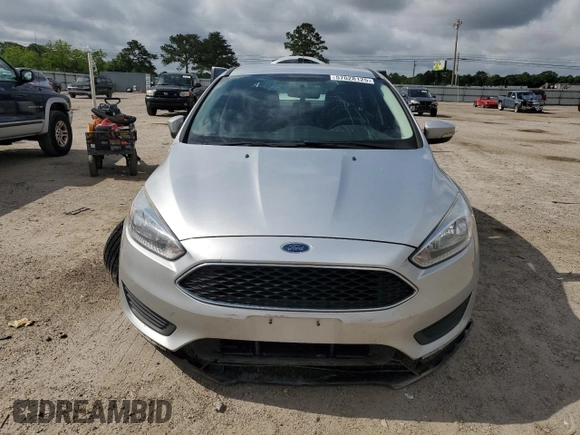 2017 Ford Focus SE with VIN 1FADP3F23HL328312, listed as a Copart auction lot 57028125 with 116,498 mi miles and Salvage title. Bid and sale history available at DreamBid. Image 5.