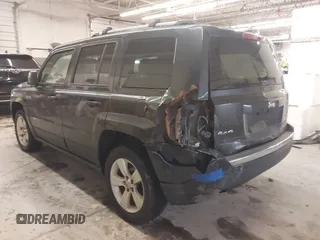 2014 Jeep Patriot Limited with VIN 1C4NJRCB7ED684811, listed as a IAAI auction lot 41833010 with 74,820 mi miles and . Bid and sale history available at carsss.com. Image 3.