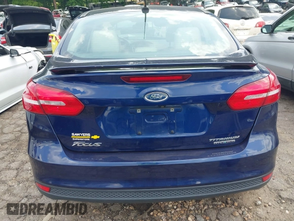 2016 Ford Focus Titanium z VIN 1FADP3J20GL208439, wystawiony jako IAAI lot #42145938 z przebiegiem 135 522 mil mil oraz . Historia ofert i sprzedaży dostępna na DreamBid. Obrazek 16.