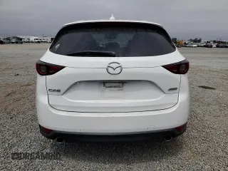 2018 Mazda CX-5 Grand Touring with VIN JM3KFADMXJ1358221, listed as a Copart auction lot 59746545 with 54,094 mi miles and Salvage title. Bid and sale history available at DreamBid. Image 6.