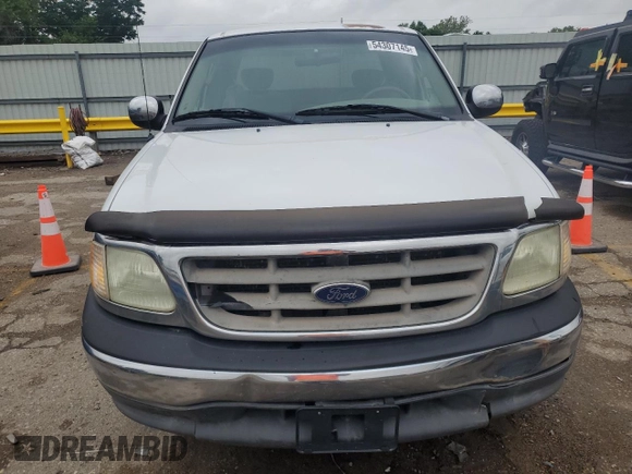 2002 Ford F-150 XL with VIN 1FTRX17L52KC49698, listed as a Copart auction lot 54307145 with 254,394 mi miles and Salvage title. Bid and sale history available at DreamBid. Image 5.