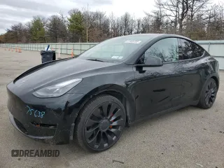 2023 Tesla Model Y Performance z VIN 7SAYGDEF7PF832498, wystawiony jako Copart lot #51455785 z przebiegiem 19 807 mil mil oraz Szkoda całkowita • Salvage title. Historia ofert i sprzedaży dostępna na DreamBid. Obrazek 1.