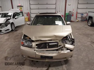 2002 Nissan Maxima GLE z VIN JN1DA31AX2T305310, wystawiony jako IAAI lot #42302521 z przebiegiem 68 920 mil mil oraz . Historia ofert i sprzedaży dostępna na DreamBid. Obrazek 12.