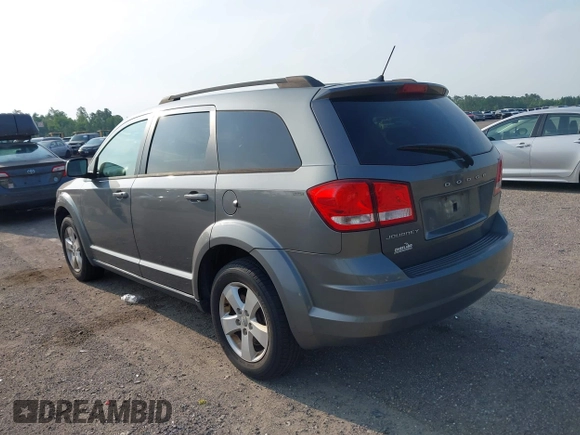 2013 Dodge Journey SE z VIN 3C4PDCAB5DT518019, wystawiony jako IAAI lot #42409340 z przebiegiem 174 339 mil mil oraz . Historia ofert i sprzedaży dostępna na DreamBid. Obrazek 3.
