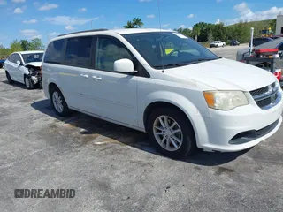 2014 Dodge Grand Caravan SXT with VIN 2C4RDGCGXER322705, listed as a IAAI auction lot 42170301 with 147,070 mi miles and . Bid and sale history available at DreamBid. Image 1.