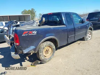 2003 Ford F-150 XL with VIN 1FTRX18L73NB36799, listed as a IAAI auction lot 41317602 with 270,075 mi miles. Bid and sale history available at carsss.com. Image 4.