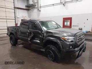 2017 Toyota Tacoma SR5 with VIN 3TMDZ5BN8HM016825, listed as a IAAI auction lot 41658400 with 166,098 mi miles. Bid and sale history available at carsss.com. Image 1.