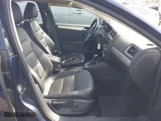 2014 Volkswagen Jetta Sedan SE with VIN 3VWD17AJ9EM303584, listed as a IAAI auction lot 41944386 with 130,921 mi miles. Bid and sale history available at carsss.com. Image 5.