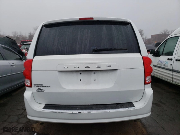 2014 Dodge Grand Caravan SE with VIN 2C4RDGBG0ER473442, listed as a Copart auction lot 49376295 with 106,092 mi miles and Salvage Title. Bid and sale history available at carsss.com. Image 6.