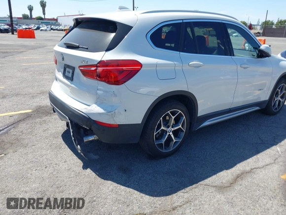2017 BMW X1 xDrive28i with VIN WBXHT3C33H5F86831, listed as a IAAI auction lot 42019082 with 74,708 mi miles and . Bid and sale history available at DreamBid. Image 4.