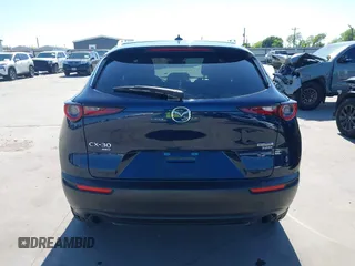 2021 Mazda CX-30 Premium with VIN 3MVDMBDYXMM307047, listed as a IAAI auction lot 41974966 with 53,409 mi miles and . Bid and sale history available at carsss.com. Image 17.