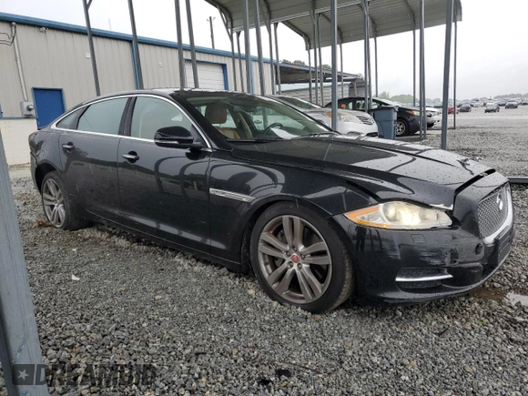 2014 Jaguar XJ Portfolio with VIN SAJWJ2GD5E8V69982, listed as a Copart auction lot 58933515 with 92,847 mi miles and Salvage title. Bid and sale history available at DreamBid. Image 4.